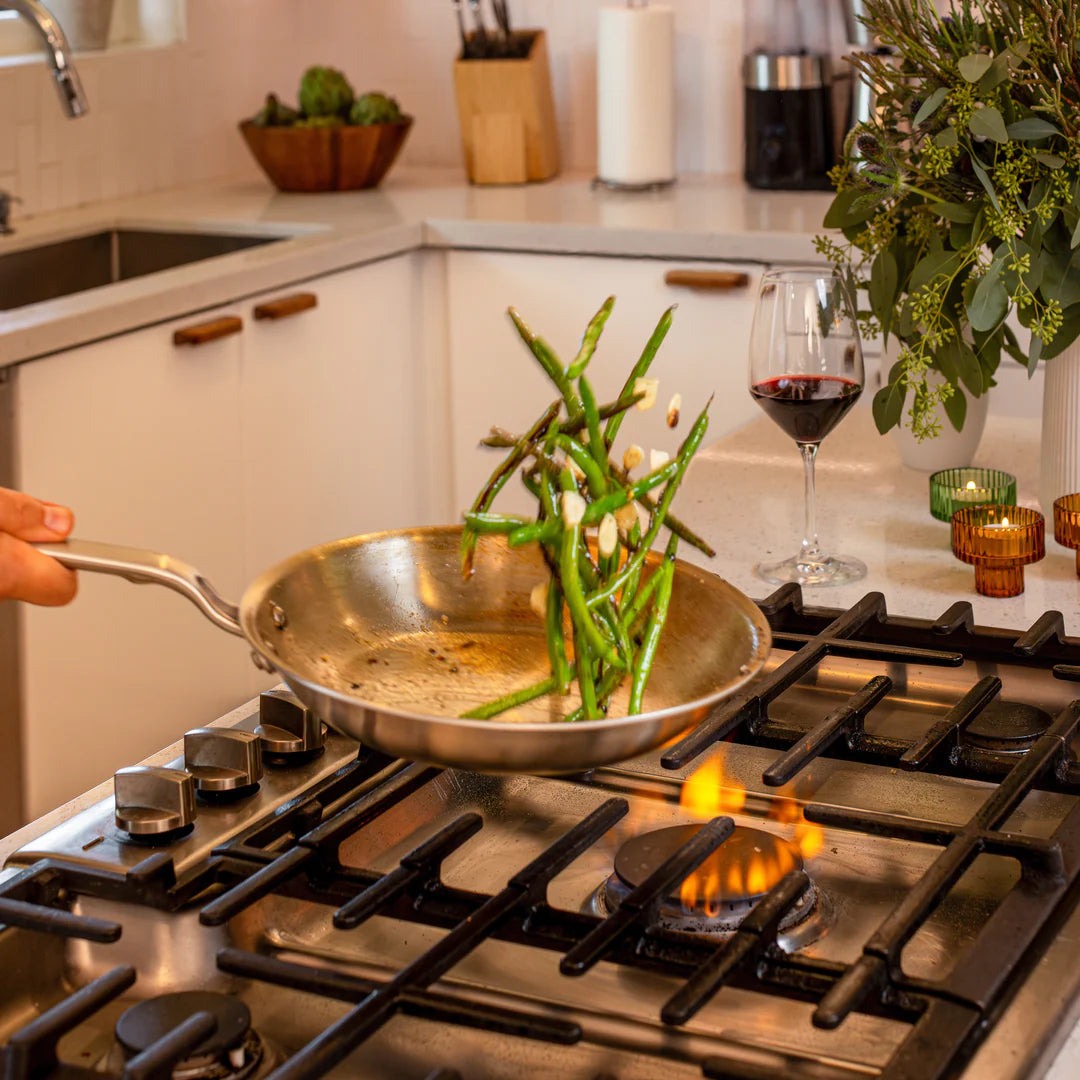 Heritage Steel 10.5" Stainless Steel Frying Pan tossing Asparagus